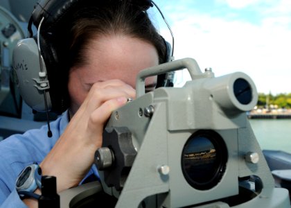 US Navy 090112-N-0879R-002 Operations Specialist 3rd Class Cassandra Roper stands starboard bridge watch