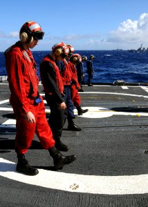 US Navy 090115-N-9758L-563 Sailors conduct a foreign object damage walk down