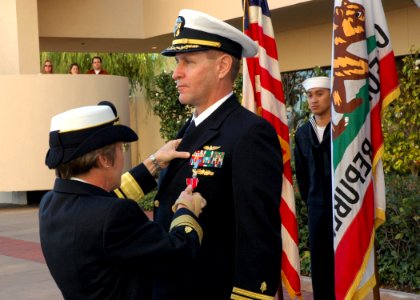 US Navy 090116-N-6326B-003 Rear Adm. Christine S. Hunter, commander, Naval Medical Center San Diego, presents the Bronze Star medal to Cmdr. Joey Swartz