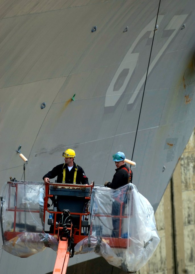 US Navy 090112-N-5253W-008 Sailors assigned to the Ticonderoga-class guided-missile cruiser USS Shiloh (CG 67), paint the ship's hull during a restricted availability maintenance period