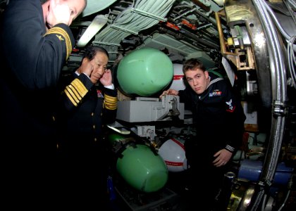 US Navy 090112-N-7705S-079 Republic of Korea Navy Chief of Naval Operations Adm. Jung Ok-Keun and Lt. Cmdr Brad Terry, left, executive officer of the Los-Angeles class attack submarine USS Boise (SSN 764) cover their ears