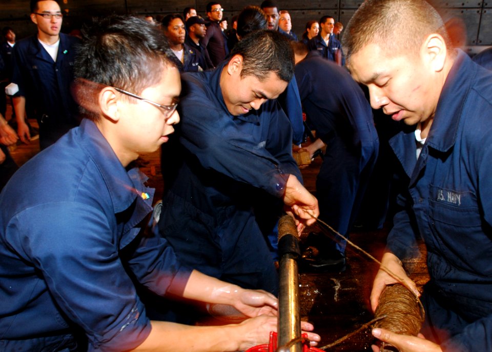 US Navy 090119-N-5681S-096 Sailors participate in a Damage Control Olympics event aboard the multi-purpose amphibious assault ship USS Iwo Jima (LHD 7)