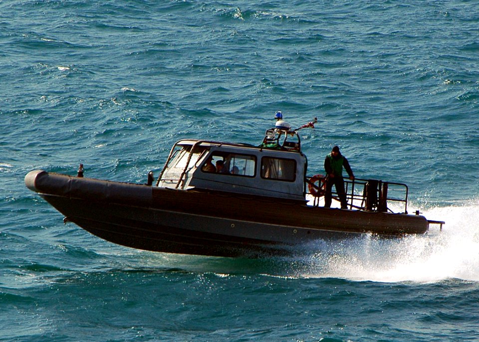 US Navy 090114-N-5681S-048 A rigid-hull inflatable boat from USS Ramage (DDG 61) approaches USS Iwo Jima (LHD 7)