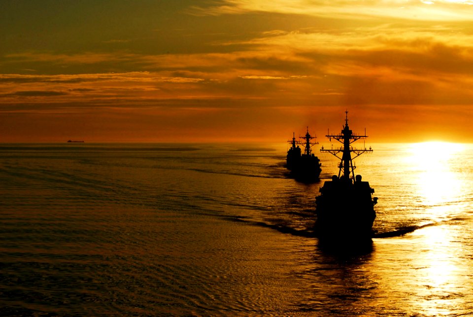 US Navy 090120-N-6538W-106 The guided-missile destroyers USS Kidd (DDG 100), front, and USS Preble (DDG 88) steam ahead of the guided-missile cruiser USS Antietam (CG 54) during a sunrise photographic exercise