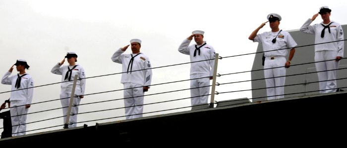 US Navy 090120-N-9758L-187 Sailors assigned to the guided-missile destroyer USS Chung-Hoon (DDG 93) deliver a hand salute as the ship departs Naval Station Pearl Harbor