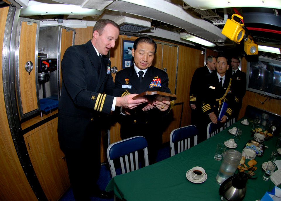 US Navy 090112-N-7705S-092 Lt. Cmdr. Brad Terry, left, executive officer of the Los-Angeles class attack submarine USS Boise (SSN 764), presents a plaque with the boat's seal to Republic of Korea Navy Chief of Naval Operations