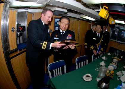 US Navy 090112-N-7705S-092 Lt. Cmdr. Brad Terry, left, executive officer of the Los-Angeles class attack submarine USS Boise (SSN 764), presents a plaque with the boat's seal to Republic of Korea Navy Chief of Naval Operations
