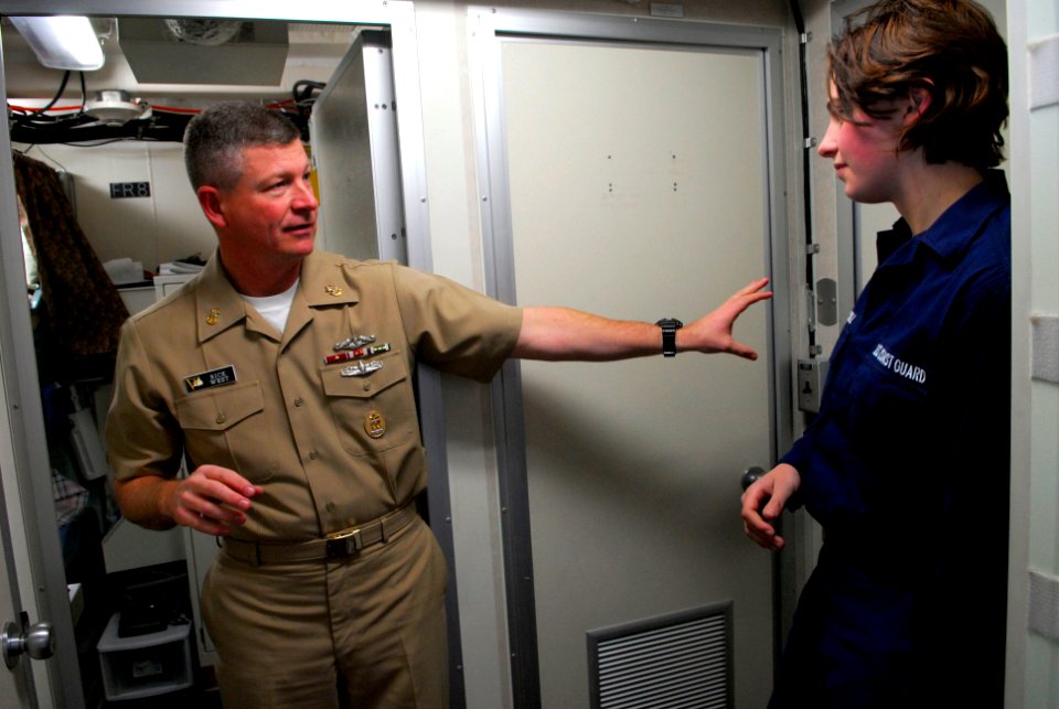 US Navy 090115-N-9818V-042 Coast Guard Seaman Branwyn Driscoll gives Master Chief Petty Officer of the Navy (MCPON) Rick West a tour of the USCG Sea Horse (WPB 87361)