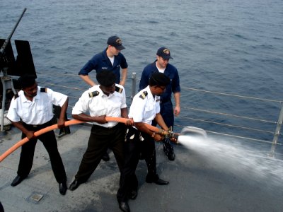 US Navy 090116-N-8270S-001 Sailors embarked aboard the guided-missile frigate USS Robert G. Bradley (FFG 49) demonstrate firefighting techniques with Sailors from the Equatorial Guinean Navy photo