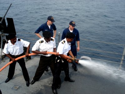 US Navy 090116-N-8270S-001 Sailors embarked aboard the guided-missile frigate USS Robert G. Bradley (FFG 49) demonstrate firefighting techniques with Sailors from the Equatorial Guinean Navy