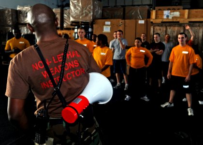 US Navy 090113-N-2908M-001 Aviation Boatswains Mate 1st Class Anthony Thomas holds close quarters training