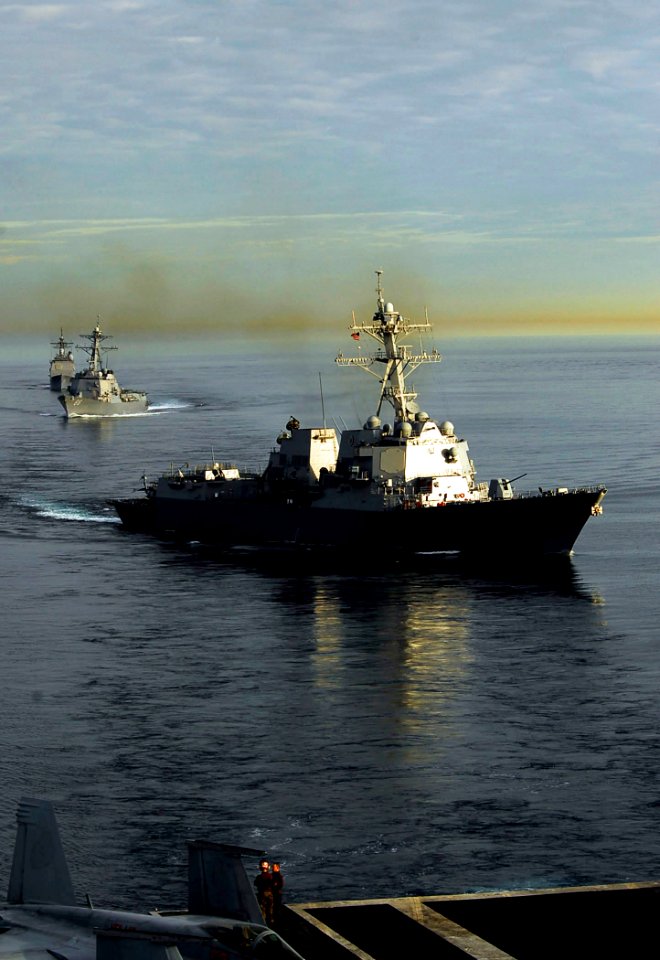 US Navy 090120-N-6538W-183 The guided-missile destroyers USS Kidd (DDG 100), front, and USS Preble (DDG 88) steam ahead of the guided-missile cruiser USS Antietam (CG 54) during a sunrise photographic exercise