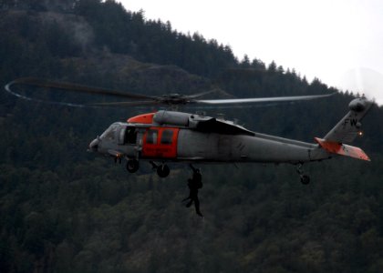 US Navy 090113-N-9860Y-001 Naval Air Station Whidbey Island search and rescue air crewmen are hoisted into an MH-60S Sea Hawk helicopter