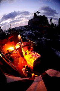 US Navy 090117-N-7918H-345 Sailors aboard the guided-missile destroyer USS Mahan (DDG 72) sort pallets during a vertical replenishment with the Military Sealift Command fleet replenishment oiler USNS Tippecanoe (T-AO 199)