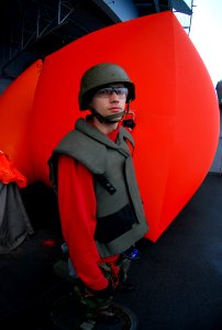 US Navy 090122-N-6597H-004 Aviation Ordnanceman 3rd Class David Kopp, from Killeen, Texas, prepares to throw a