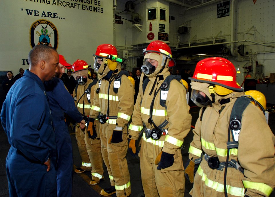 US Navy 090119-N-5681S-082 Sailors compete in a Damage Control Olympics event aboard the multi-purpose amphibious assault ship USS Iwo Jima (LHD 7)