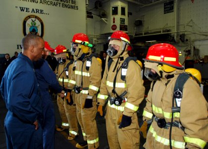 US Navy 090119-N-5681S-082 Sailors compete in a Damage Control Olympics event aboard the multi-purpose amphibious assault ship USS Iwo Jima (LHD 7)