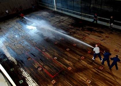 US Navy 090119-N-5681S-004 Sailors participate in a Damage Control Olympics event aboard the multi-purpose amphibious assault ship USS Iwo Jima (LHD 7)