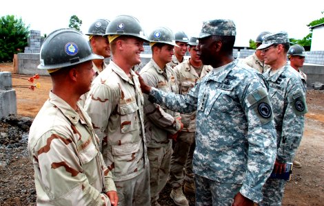 US Navy 090123-N-1540F-008 Gen. William E. Ward and Command Sgt. Maj. Mark Ripka meets Seabees who are building a six-classroom schoolhouse as part of humanitarian civic assistance project