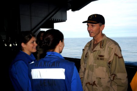 US Navy 090119-N-7571S-005 Adm. Jonathan W. Greenert speaks with ABHAN Jean Blair and ABH Priscilla Strong in the hangar bay during his brief visit aboard the aircraft carrier USS Theodore Roosevelt (CVN 71)