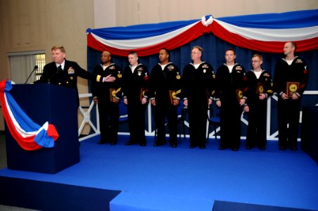 US Navy 090116-N-7526R-016 Rear Adm. David Mercer congratulates seven Sailor of the Year candidates during a ceremony at Naval Support Activity Naples