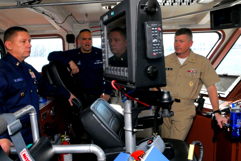 US Navy 090115-N-9818V-055 Coast Guard Master Chief Boatswain's Mate Bill James gives Master Chief of the Coast Guard Skip Bowen and Master Chief Petty Officer of the Navy (MCPON) Rick West a tour of USCG Sea Horse (WPB 87361)