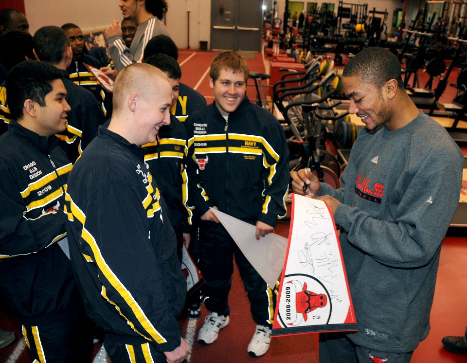US Navy 090121-N-8848T-928 Chicago Bulls guard Derrick Rose signs autographs for a group of Chicago-area recruits at the Chicago Bulls Berto Center practice facility