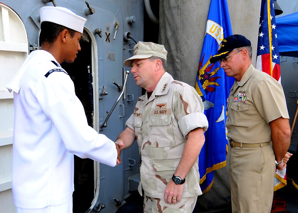 US Navy 090126-N-1082Z-010 Vice Adm. Bill Gortney greets Seaman Christopher A. Contreras aboard USS Vella Gulf (CG 72)
