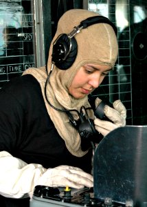 US Navy 090122-N-9134V-038 Operations Specialist Seaman Kimberly Pagan, from Brooklyn, N.Y., communicates with the combat information center during a general quarters drill aboard the amphibious dock landing ship USS Carter Hal