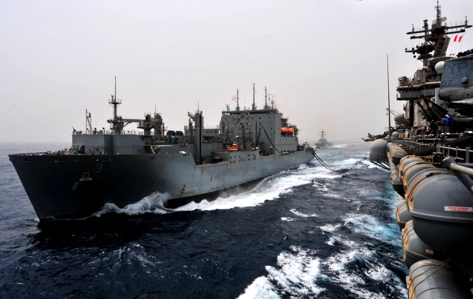 US Navy 110711-N-ZS026-391 The Military Sealift Command dry cargo and ammunition ship USNS Alan Shepard (T-AKE 3), left, transfers fuel and stores