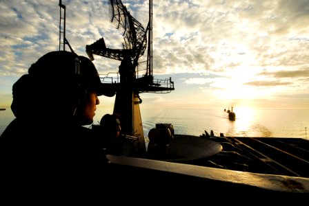 US Navy 090120-N-6538W-116 Seaman Sean Flaherty, from Philadelphia, stands aft port lookout watch aboard the aircraft carrier USS John C. Stennis (CVN 74)