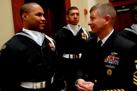 US Navy 090123-N-9818V-338 Master Chief Petty Officer of the Navy (MCPON) Rick West speaks with Airman Mervin Laravasquez, assigned to the U.S. Navy Ceremonial Guard photo