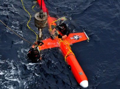 US Navy 110611-N-XR557-250 Boatswain's Mate 3rd Class Christian Riddle, left, and Boatswain's Mate 2nd Class Dante Galati secure a recovered BQM-74 photo