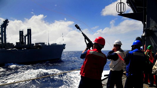 US Navy 090128-N-4774B-040 Sailors ire a shot line to the Military Sealift Command combat stores ship USNS San Jose (T-AFS 7)