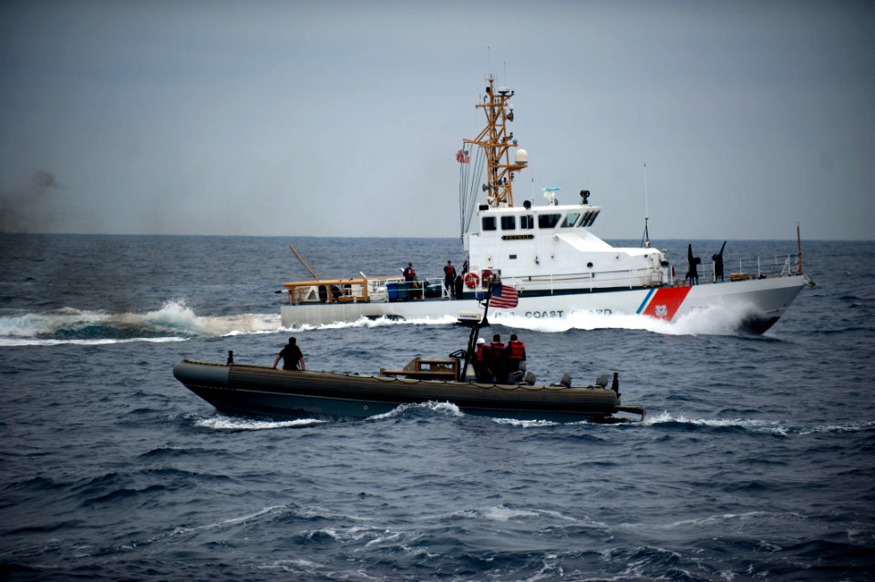 US Navy 110820-N-PB383-334 Sailors from the USS New Orleans turn over suspected drugs to the Coast Guard