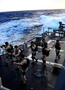 US Navy 090127-N-4774B-029 Sailors aboard the guided-missile cruiser USS Lake Champlain (CG 57) rehearse procedures during a visit, board, search, and seizure exercise photo