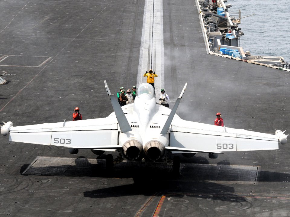 US Navy 110906-N-QL471-175 Sailors perform pre-launch checks on an EA-18G growler