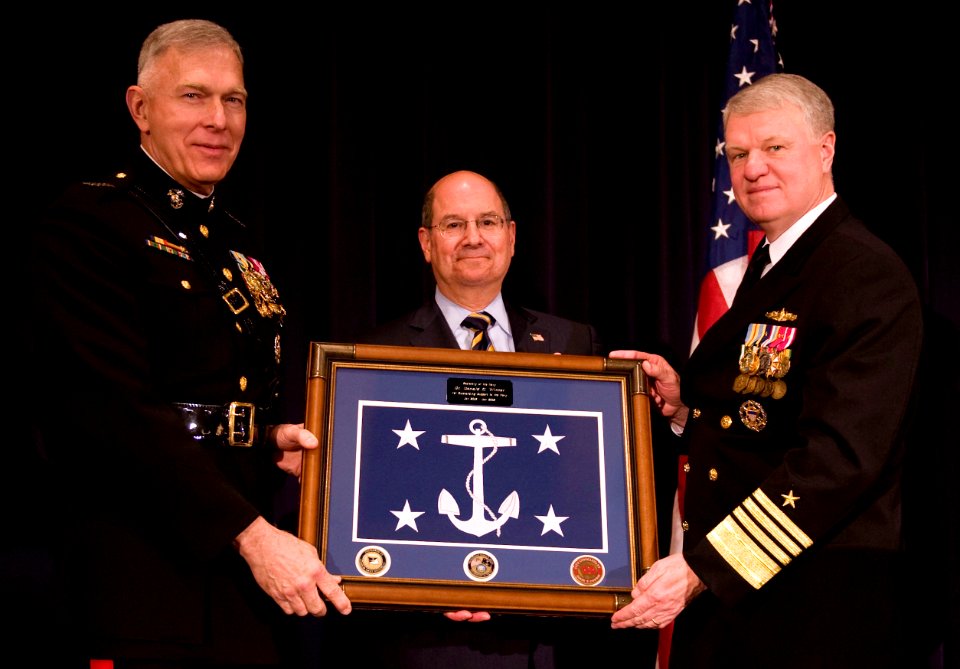 US Navy 090123-N-7090S-315 Secretary of the Navy (SECNAV) the Honorable Dr. Donald C. Winter is presented the official Secretary of the Navy flag by Commandant of the Marine Corps Gen. James T. Conway, left, and Chief of Naval