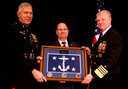 US Navy 090123-N-7090S-315 Secretary of the Navy (SECNAV) the Honorable Dr. Donald C. Winter is presented the official Secretary of the Navy flag by Commandant of the Marine Corps Gen. James T. Conway, left, and Chief of Naval
