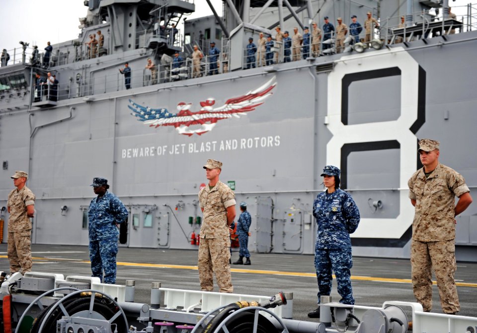 US Navy 110810-N-DX615-008 Sailors and Marines man the rails aboard USS Makin Island (LHD 8)
