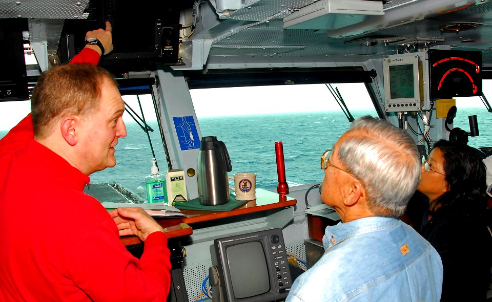 US Navy 090126-N-6597H-067 Capt. Joseph Kuzmick explains to distinguished visitors how general operations are conducted aboard the ship