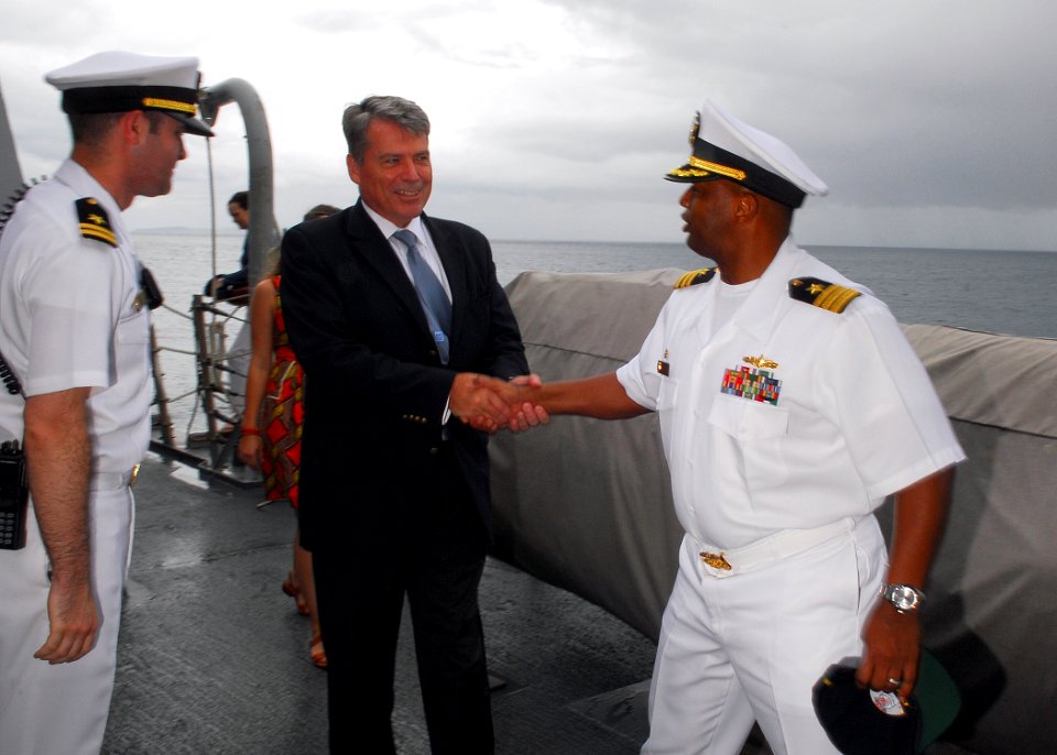 US Navy 090131-N-2013O-043 Cmdr. Anthony Simmons, commanding officer of the Arleigh Burke-class guided-missile destroyer USS Lassen (DDG 82) greets Cameron R. Hume, U.S. Ambassador to Indonesia
