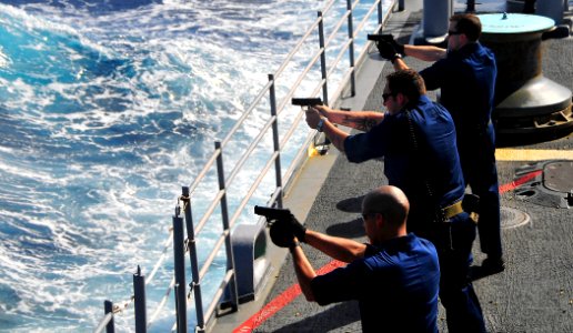US Navy 090128-N-4774B-032 Sailors fire the Beretta M9 9mm pistol during live-fire training photo