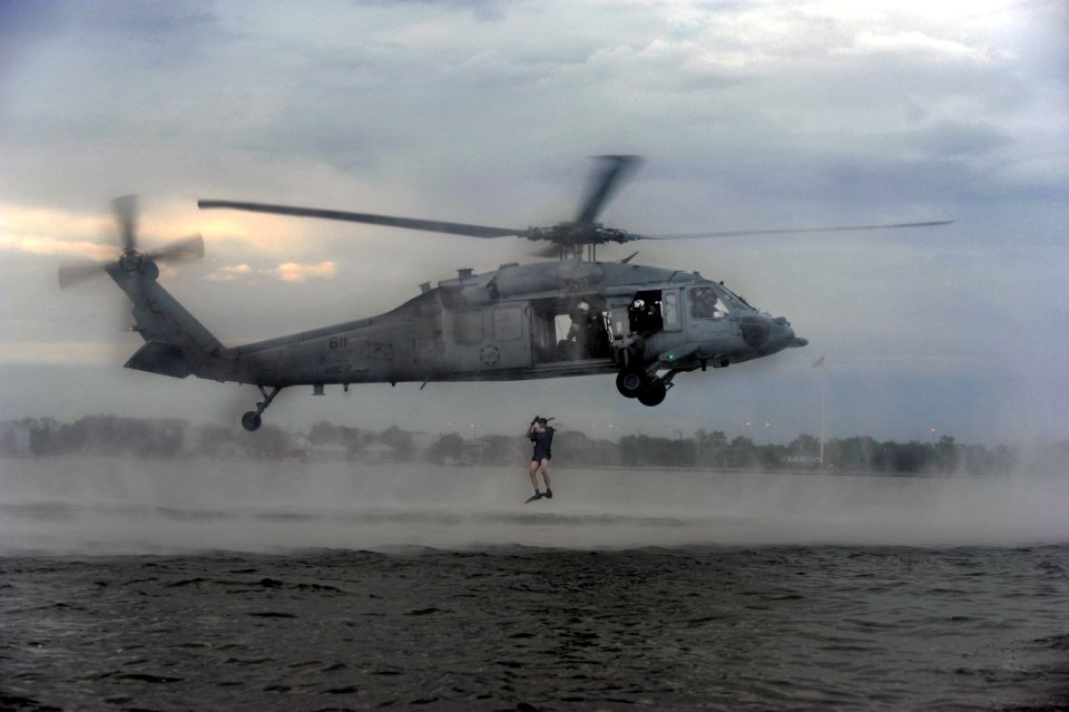 US Navy 110921-N-XZ912-194 Members of Helicopter Sea Combat Squadron (HSC) 7 perform search and rescue jumps for qualification