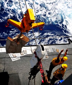 US Navy 090128-N-4774B-047 Petty officers in charge signal to the Military Sealift Command combat stores ship USNS San Jose (T-AFS 7) during a replenishment at sea