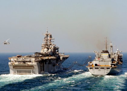 US Navy 090129-N-3392P-071 The multi-purpose amphibious assault ship USS Iwo Jima (LHD 7) conducts a replenishment-at-sea with the Military Sealift Command fast combat support ship USNS Supply (T-AOE 6)