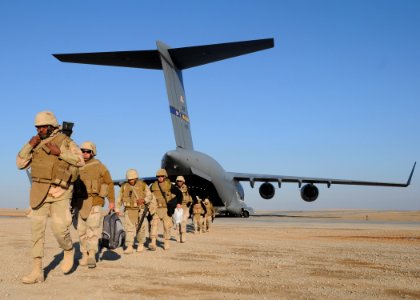 US Navy 090128-N-1120L-144 Seabees depart an Air Force C-17 aircraft