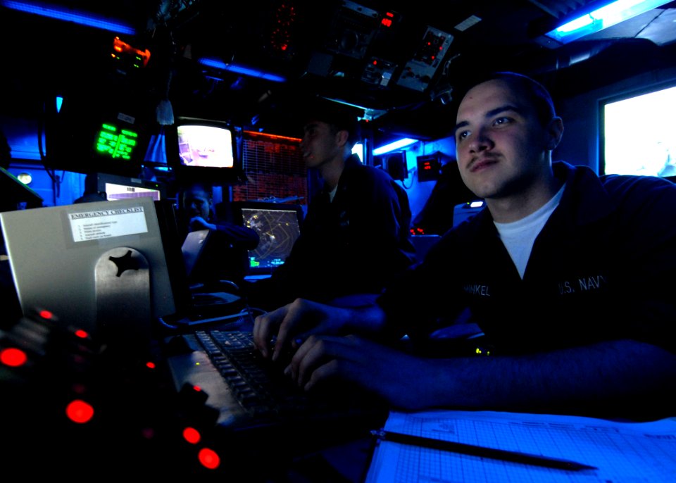 US Navy 090129-N-9950J-021 Air Traffic Controller Airman Apprentice Adam Minkel works at his desk in the amphibious air traffic control center