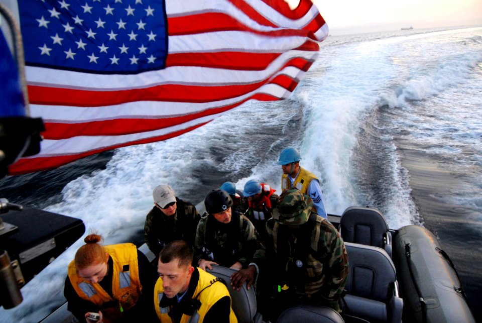 US Navy 090203-N-1688B-035 Sailors assigned to the amphibious transport dock ship USS Nashville (LPD 13) ride a rigid hull inflatable boat to the pier in Dakar, Senegal to prepare for Nashville's arrival