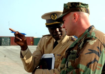 US Navy 090204-N-1655H-127 Chief Engineman Edward Young speaks with an African naval officer photo
